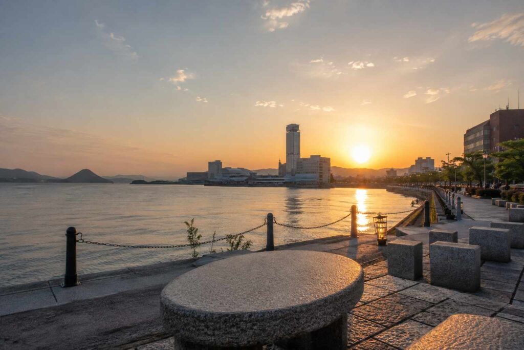 Sunset view of Takamatsu waterfront and Seto Inland Sea promenade, reflecting the calm and romantic atmosphere of adult dating culture in Kagawa, Japan.